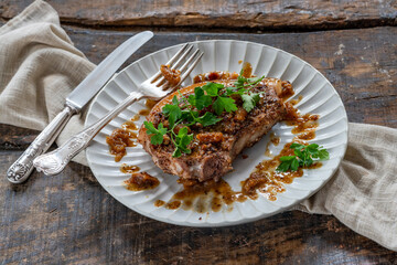 Walnut-crusted pork chop with figs sauce