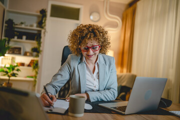 One happy woman work from home or office sit by the desk use laptop