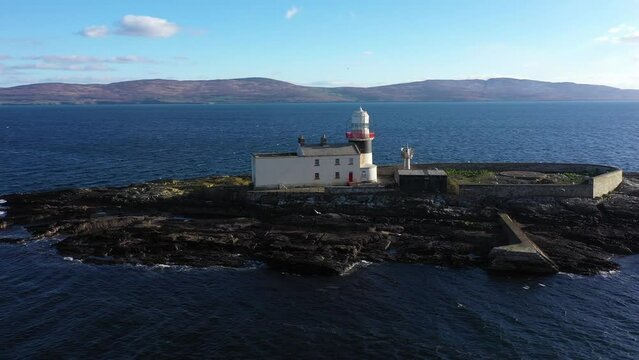 Aerial footage Roancarrigmore Lighthouse, Bantry Bay, West Cork, Ireland 4K
Shot by a drone which flies in orbit. Rocky coast and rough sea waves.