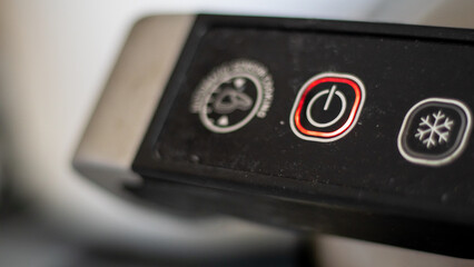 Electric grill power adjustment indicators and power button. The degree of doneness of the steak. Contact grill. Cooking in the home kitchen.