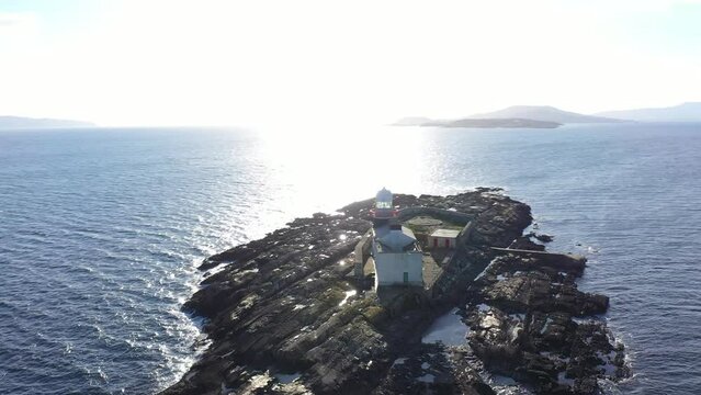 Aerial footage Roancarrigmore Lighthouse, Bantry Bay, West Cork, Ireland 4K
Shot by a drone which flies in orbit. Rocky coast and rough sea waves.