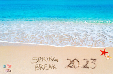 spring break 2023 written on the beach