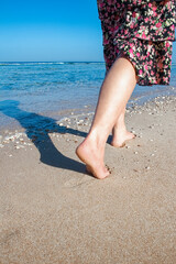 Beautiful traces with feet on sea nature background