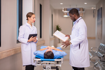 Obraz premium medic running with gurney along hospital corridor