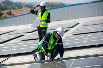 Installing solar photovoltaic panel system. Solar panel technician installing solar panels on roof. Alternative energy ecological concept.