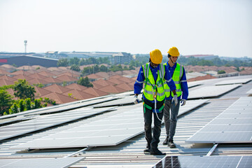 Engineer service check installation solar cell on the roof of factory. technician checks the maintenance of the solar panels, engineering team working on checking and maintenance in solar power plant
