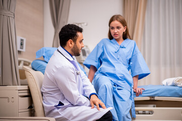Fototapeta premium Doctor examining patient in hospital.
