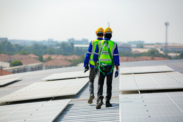 Workers assemble energy system with solar panel for electricity