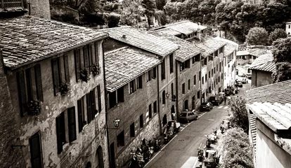 Foto op Canvas A typical street scene in old Tuscany in sepia © Shy Radar