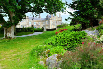 Fototapeta na wymiar Muckross House through it's beautiful garden in Killarney National Park, Ring of Kerry, Ireland