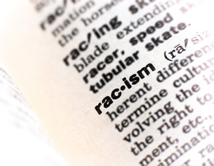 closeup of the word racism - obrazy, fototapety, plakaty