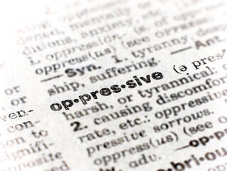 Closeup of the word oppressive