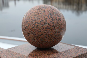 granite ball on the embankment