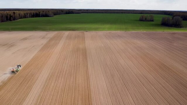 Drone planting wheat in the field on Valtra tractor with Topcon Agriculture
