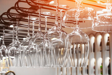 close-up of wine glasses hanging in a restaurant, suspended