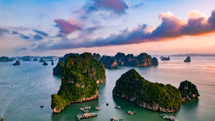 Drone shot of a sunset over Ha Long Bay in Vietnam during sunset with islands and sea/ocean view...