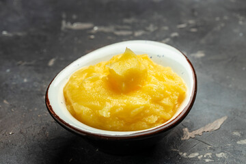 Ghee or clarified butter. cooking oil, pure ghee. Healthy fat diet concept. banner, menu, recipe place for text, top view