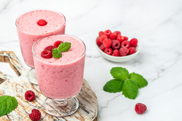 raspberry dessert in glass jar with berries. Yogurt cocktail on a white background. place for text, top view