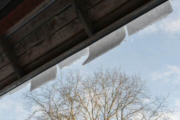 Snow falling from the roof