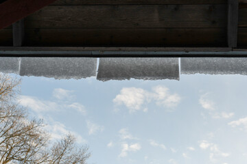 Snow falling from the roof