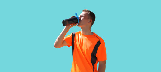 Portrait of tired runner man drinking from bottle the water or protein shake, male sportsman...