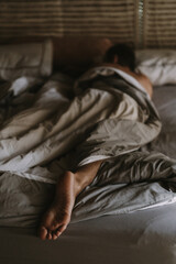 Man in bed in the morning.