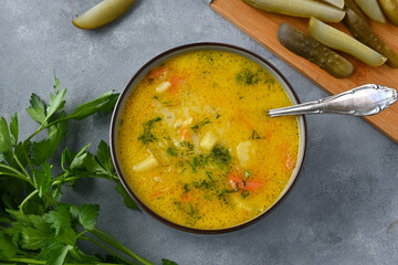 Cucumber soup - traditional Polish soup with pickled cucumbers, potatoes, carrots and dill