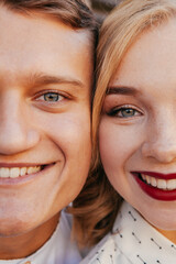 Beautiful couple smiling and posing in the city
