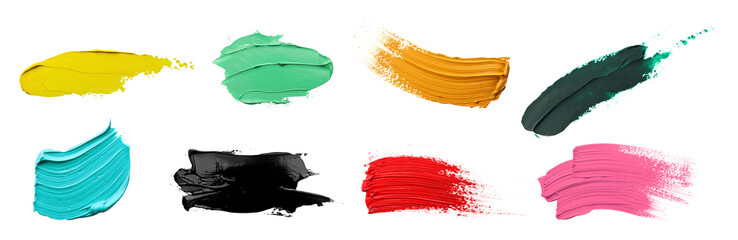 Set with strokes of colorful oil paints on white background, top view