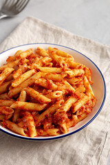 Homemade Penne With Tomato Sauce on a Plate, low angle view.