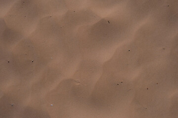 Fine soft and warm sand on the sea coast, background