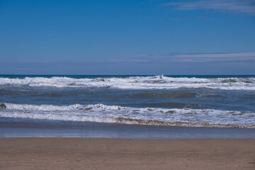 Sea wave in a turbulent sea, foam and splashes, background