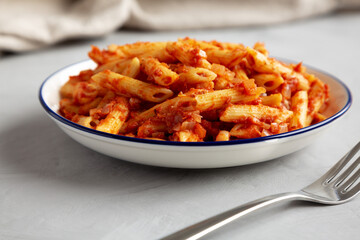 Homemade Penne With Tomato Sauce on a Plate, low angle view. Close-up.
