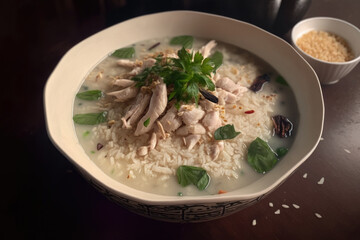 pieces of boiled chicken with rice porridge