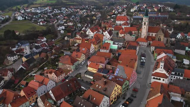 Aerial around the old town Nabburg in Germany, Bavaria. on a cloudy afternoon in late winter