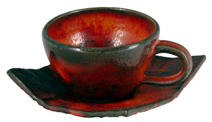 An empty earthenware cup being fired in a kiln. Isolated background.