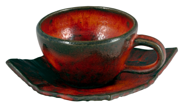 An empty earthenware cup being fired in a kiln. Isolated background.