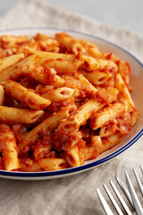 Homemade Penne With Tomato Sauce on a Plate, side view. Close-up.