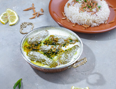 Zucchini stuffed with meat and laban al jamid from the Syrian Cuisine, its name food is Sheikh Al-Mahshi