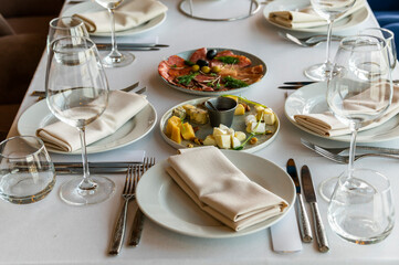 cold cuts with olives and black olives on a served table