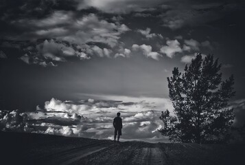 Man walking above the clouds.