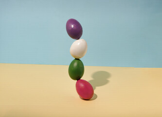 Easter eggs placed upright on a pastel background. Minimal easter holiday concept.