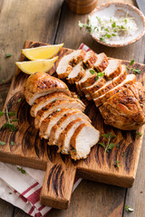 Grilled or roasted chicken breast on a serving plate © fahrwasser