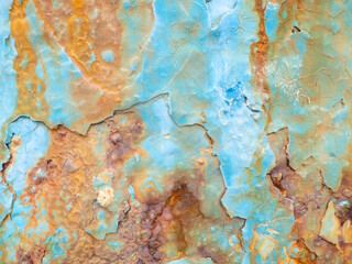 Rust on a blue surface. Cracks in the paint. Old iron. Rusty stains on metal.