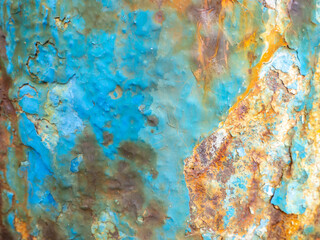Rust on a blue surface. Cracks in the paint. Old iron. Rusty metal.