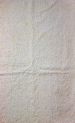 Fototapeta premium The texture of a light beige bath towel with a large volume