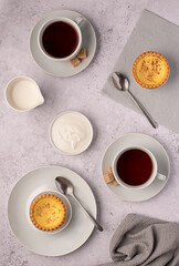 Food photography of tea, milk, coffee, yogurt, custard tart, sugar,  beverage, drink, breakfast