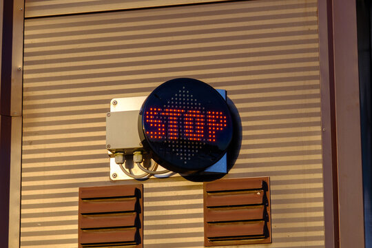 Red LED light inscription with warning. stop