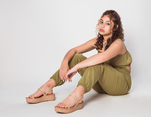 Adorable teen girl modeling studio photoshoot, fashion for teenagers concept