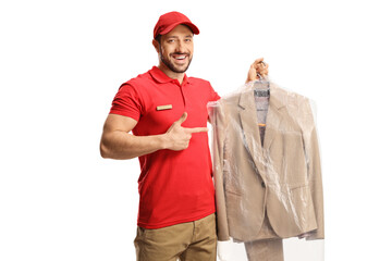 Dry cleaning worker holding a suit on a hanger with a plastic cover